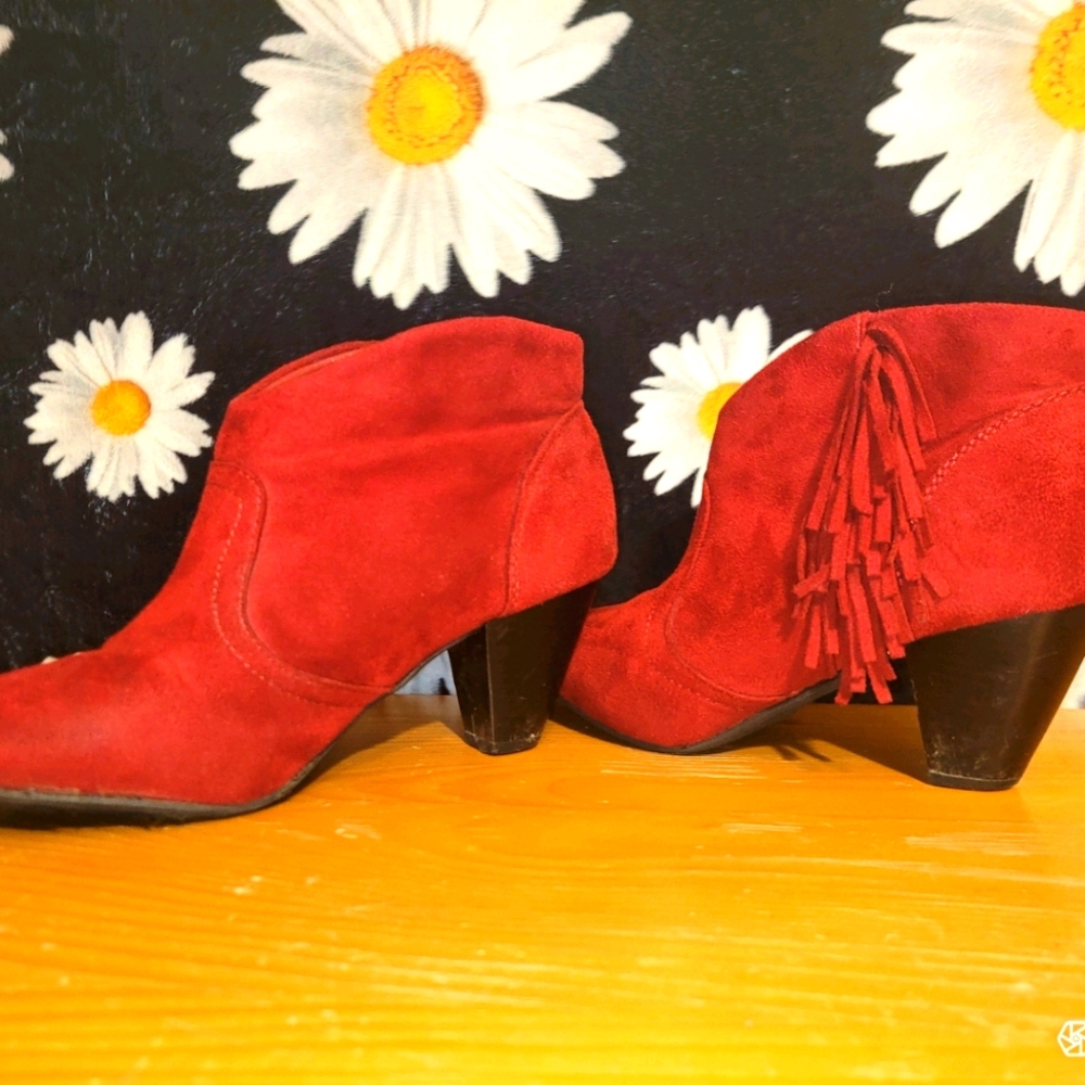 Red suede bootie heels with fringe.